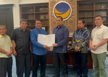 Sah! DPP NasDem Berikan SK untuk Paslon Haili Yoga dan Muchsin Hasan 